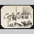 Group of young adults around a table (ddr-densho-542-669)