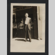 Photograph of Yoneo Suzuki in front of a pharmacy store (ddr-csujad-55-2673)