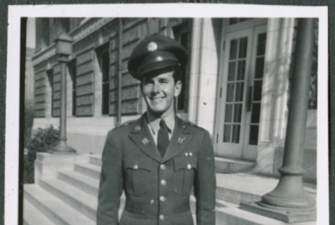 Man standing on steps of building (ddr-densho-434-487)