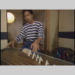 Taiko performance, part 2 of 2; exterior Tokyo footage; Brian Yamakoshi koto setup and performance, part 1 of 2 (ddr-densho-1007-1724)