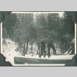 Two men standing on bridge in snow (ddr-ajah-2-361)