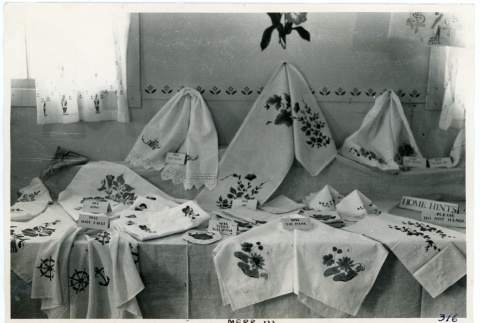 Photograph of an exhibit of textiles created at Manzanar (ddr-csujad-47-75)