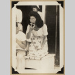 Kiyo eating a watermelon (ddr-densho-542-573)