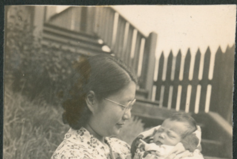 Woman holding a baby (ddr-densho-523-54)