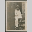 Woman poses on steps (ddr-densho-359-688)