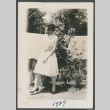 woman walking outside (ddr-densho-378-728)