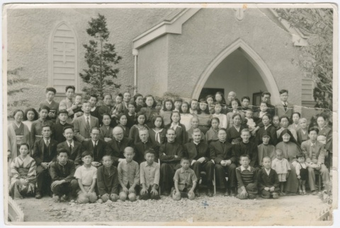 (Photograph) - Image of  priests, nuns, men, women and children outside church (Front) (ddr-densho-330-277-mezzanine-f4e0fbd1c1)