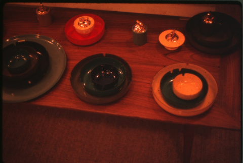 Display of lacquerware ashtrays and lighters (ddr-densho-426-321)