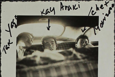 Three men in the backseat of a car (ddr-densho-321-1343)