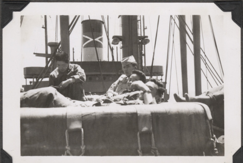 Men relaxing on board ship (ddr-densho-466-162)
