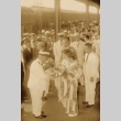 Mineo Osumi receiving flowers at Tokyo Station (ddr-njpa-4-1809)