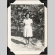 Woman standing by small trees (ddr-densho-587-21)