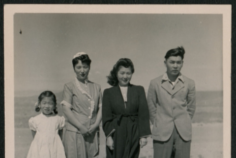 Group photo of two women, one man, and a young girl (ddr-densho-362-34)