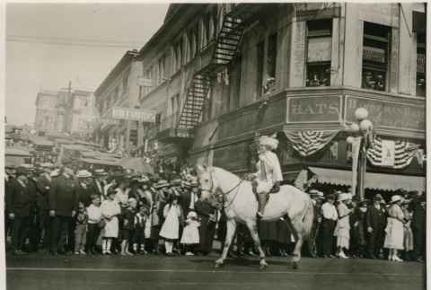 Woman on horseback in parade (ddr-densho-351-11)