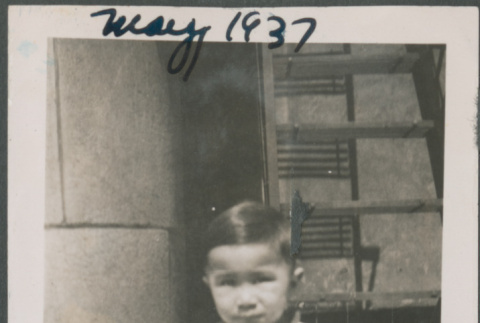 Toddler sitting on curb (ddr-densho-483-682)