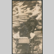Dog in baby carriage (ddr-densho-523-35)