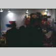 Group looking at enamel and lacquerware display (ddr-densho-426-333)
