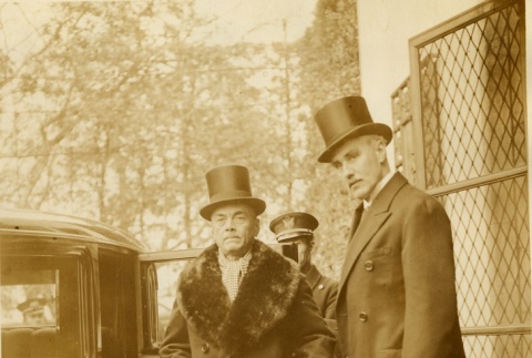 Manuel Quezon getting into a car with another man (ddr-njpa-1-1440)