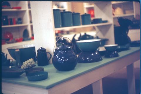 Display of enamelware bowls and pots, lacquerware ashtrays (ddr-densho-426-323)