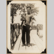 Dr. Nagata holding a toddler (ddr-densho-542-566)