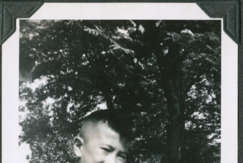 Photo of Paul Ima holding a dog (ddr-densho-483-1298)