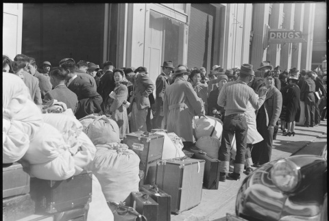 Japanese Americans waiting for the bus (ddr-densho-151-105)