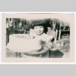 Young girl with birthday cake (ddr-densho-475-357)