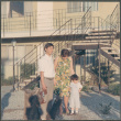 Couple with boy standing by stairs (ddr-densho-523-430)