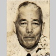 Takashi Isaka wearing leis (ddr-njpa-4-183)