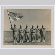 Boy Scout leaders posing with a flag (ddr-densho-223-47)