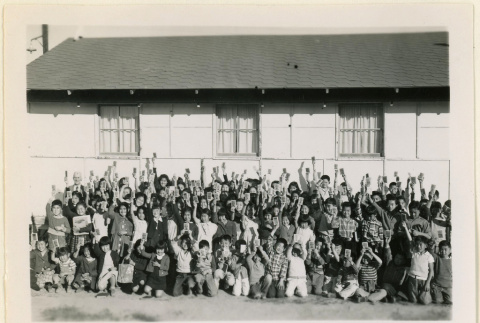 Group of children holding up cards (ddr-densho-37-1339)