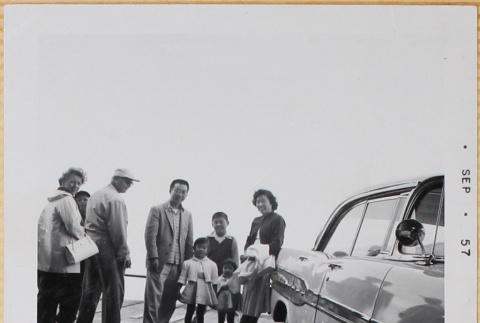 Shiomi family with others standing by car (ddr-densho-522-562)