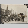 Group of men walking on street (ddr-densho-326-104)