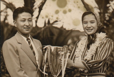 Takiko Mizunoe and a man holding a trophy (ddr-njpa-4-735)