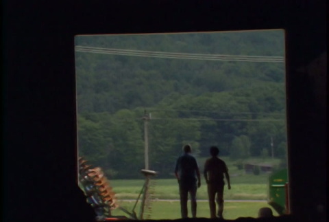 William Kochiyama and Robert H. Foote walking around a Cornell university farm; B-roll from farm (ddr-densho-1007-1519)
