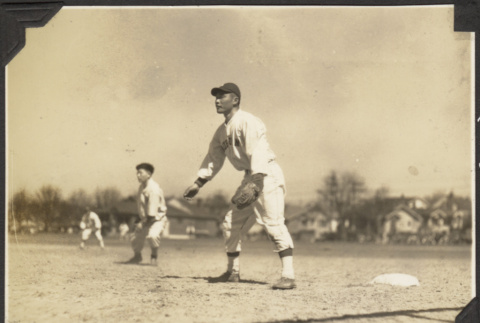 Three men in baseball outfield (ddr-densho-326-454)