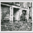 Soldiers and civilians in rubble in Bruyeres (ddr-densho-1007-40)