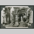Group of men waiting (ddr-densho-540-67)