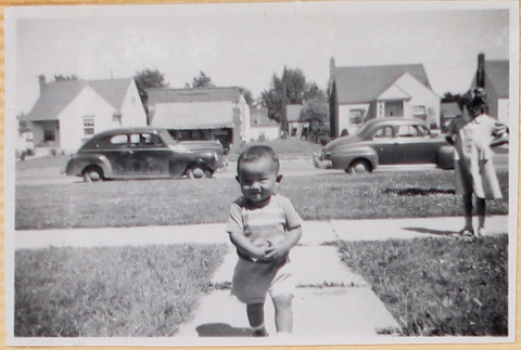 Young boy on sidewalk (ddr-densho-522-68)