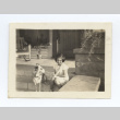 Girl sits on a porch with her dog (ddr-one-6-9)