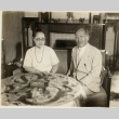 A woman and man seated at a table (ddr-njpa-1-1737)