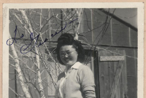 Signed photograph of woman in front of barracks (ddr-manz-10-80)