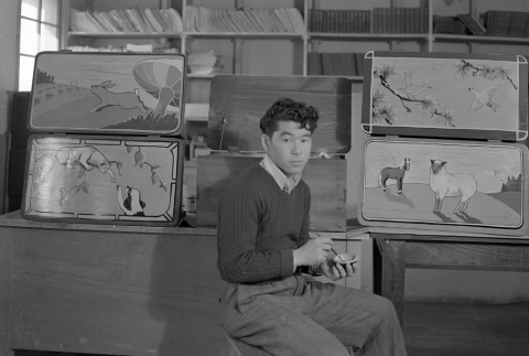An artist with his paintings (ddr-fom-1-660)