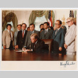 Men standing behind President Jimmy Carter in White House, signing of Commission of Wartime Relocation and Internment of Citizens Act into law (ddr-densho-393-5)
