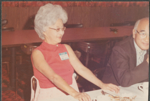 Agnes Sakura sitting at table (ddr-densho-523-652)