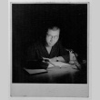 Figure at table with book (ddr-densho-1007-52)