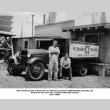 Two men by Ice delivery truck (ddr-ajah-6-411)