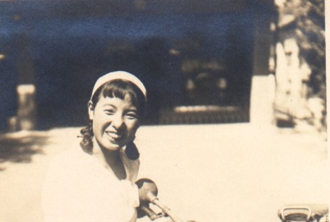 Kikuko Matsumoto posing with motorcycle (ddr-njpa-4-844)