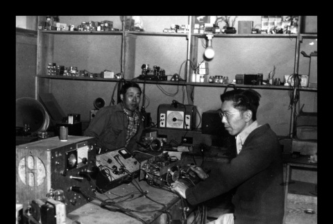 Radio repair staff, Amache Co-op (ddr-csujad-55-1571)