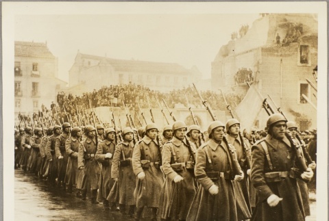 Spanish soldiers marching past civilian onlookers (ddr-njpa-13-630)